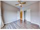 Bedroom with ceiling fan, closet, and hardwood floors at 1516 Dusty Canyon St, Henderson, NV 89052