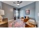 Bedroom with modern decor, hardwood floors, and ceiling fan at 1516 Dusty Canyon St, Henderson, NV 89052