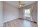 Bedroom with window overlooking pool and hardwood floors at 1516 Dusty Canyon St, Henderson, NV 89052