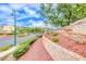 Landscaped entrance to the Naples community with stone signage, mature trees, and well-maintained grounds at 1516 Dusty Canyon St, Henderson, NV 89052