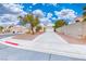 A beautiful single-story home with a long driveway and desert landscaping at 1516 Dusty Canyon St, Henderson, NV 89052