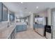 Open-concept kitchen with tile flooring, stainless steel appliances, and plenty of counter space at 1516 Dusty Canyon St, Henderson, NV 89052