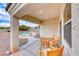 Inviting covered patio seating area with direct views of the backyard pool for relaxation and outdoor dining at 1516 Dusty Canyon St, Henderson, NV 89052