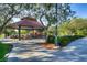 Community picnic area featuring shaded tables, a playground in the background, and mature trees at 1516 Dusty Canyon St, Henderson, NV 89052