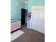Bright Bedroom features a white crib, daisy-themed wall decor, and a closet at 170 Magnolia Blvd, Pahrump, NV 89048