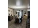 Well-decorated dining area showcases a rustic table, charming decor, and natural light from the window at 170 Magnolia Blvd, Pahrump, NV 89048