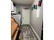 Functional laundry room with storage cabinets, modern washer and dryer, and stylish rug at 170 Magnolia Blvd, Pahrump, NV 89048
