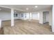 Spacious living room featuring modern flooring and bright, neutral paint that fills the area with natural light at 1731 Sherwin Ln, Las Vegas, NV 89156