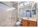 This bathroom features a frosted glass shower door, a toilet, and a vanity with a mirrored wall at 1821 Eagle Mesa Ave, Henderson, NV 89012