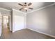 The bedroom has a closet and a ceiling fan and neutral colored walls and flooring at 1821 Eagle Mesa Ave, Henderson, NV 89012