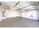 Garage featuring epoxy flooring, storage cabinets, and overhead racks for optimal storage at 1821 Eagle Mesa Ave, Henderson, NV 89012