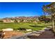Scenic golf course view with desert mountains in the background at 1821 Eagle Mesa Ave, Henderson, NV 89012