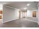 Spacious living room with neutral walls, modern trim and sleek hardwood floors at 1821 Eagle Mesa Ave, Henderson, NV 89012