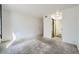 Bright bedroom with soft carpet, en-suite bathroom with glass-enclosed shower, and large closet for storage at 2110 Sealion Dr # 101, Las Vegas, NV 89128