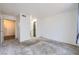 Spacious bedroom with neutral carpet and multiple doorways for convenient access to other areas of the home at 2110 Sealion Dr # 101, Las Vegas, NV 89128