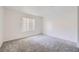 Large, neutral bedroom with a big window, plush carpeting, and a relaxing atmosphere at 2110 Sealion Dr # 101, Las Vegas, NV 89128