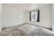 Neutral bedroom with natural light, carpeting, and a modern window with views of the outdoors at 2110 Sealion Dr # 101, Las Vegas, NV 89128