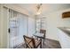 Bright breakfast nook with sliding glass doors, a ceiling fan, and a small table perfect for enjoying morning coffee at 2110 Sealion Dr # 101, Las Vegas, NV 89128