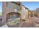 Exterior view of condo complex with multiple balconies, walkway, and desert landscaping at 2110 Sealion Dr # 101, Las Vegas, NV 89128