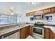 This kitchen includes stainless steel appliances, and a modern faucet at 2110 Sealion Dr # 101, Las Vegas, NV 89128