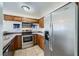 The kitchen is equipped with stainless steel appliances and tile flooring at 2110 Sealion Dr # 101, Las Vegas, NV 89128