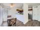 Living room view that showcases an inviting breakfast nook and functional kitchen with a stainless steel refrigerator at 2110 Sealion Dr # 101, Las Vegas, NV 89128
