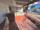 The back yard contains a covered hot tub with a red brick patio at 2208 E Ogden Ave, Las Vegas, NV 89101