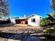 Backyard view with covered patio and house exterior on a sunny day at 2208 E Ogden Ave, Las Vegas, NV 89101