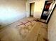 Compact bedroom with tiled floors and light pink wallpaper at 2208 E Ogden Ave, Las Vegas, NV 89101