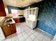 Kitchen features tile flooring and blue wallpaper at 2208 E Ogden Ave, Las Vegas, NV 89101