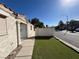 The home is on a corner lot and features an artificial turf front yard at 2228 Saint Paul Way, Las Vegas, NV 89104