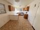 Functional kitchen featuring ample counter space, cabinetry, white appliances, and tile flooring at 2228 Saint Paul Way, Las Vegas, NV 89104