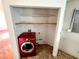 Convenient laundry room with shelves and red washing machine at 2228 Saint Paul Way, Las Vegas, NV 89104
