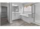 This bathroom features a vanity, a soaking tub with tile surround and a walk-in shower at 2231 Desert Prairie St, Las Vegas, NV 89135