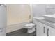 Bathroom with white vanity, toilet, and bathtub with shower at 2231 Desert Prairie St, Las Vegas, NV 89135