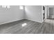 Cozy bedroom featuring wood floors and natural light from the windows at 2231 Desert Prairie St, Las Vegas, NV 89135