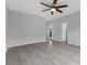 This bedroom features wood look floors, a ceiling fan, and two doorways at 2231 Desert Prairie St, Las Vegas, NV 89135