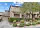 A well-manicured lawn and mature trees enhance this attractive home's curb appeal at 2231 Desert Prairie St, Las Vegas, NV 89135