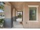 Covered entryway with neutral toned walls and decorative archways at 2231 Desert Prairie St, Las Vegas, NV 89135