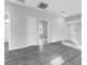 Hallway with light wood floors and doors leading to other rooms at 2231 Desert Prairie St, Las Vegas, NV 89135