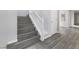 Staircase with light wood steps and white railing at 2231 Desert Prairie St, Las Vegas, NV 89135