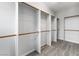 This is a walk-in closet with built-in shelving and wood closet rods at 2231 Desert Prairie St, Las Vegas, NV 89135