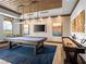 Game room with a pool table, shuffleboard, and modern decor at 2376 Thelen Ave, North Las Vegas, NV 89086