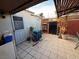 Backyard patio area with outdoor furniture and trash cans at 2425 Paradise Village Way, Las Vegas, NV 89120