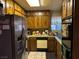 A kitchen featuring stainless steel refrigerator and wood cabinets at 2425 Paradise Village Way, Las Vegas, NV 89120