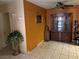 A living room featuring tile flooring and a decorative china cabinet at 2425 Paradise Village Way, Las Vegas, NV 89120
