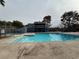 Community pool with building and balcony at 2425 Paradise Village Way, Las Vegas, NV 89120