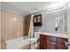 Compact bathroom featuring a combined shower and tub, toilet, and storage cabinet at 2451 N Rainbow Blvd # 2067, Las Vegas, NV 89108