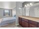 Bathroom featuring a granite vanity top, framed mirror and a window for natural light at 2451 N Rainbow Blvd # 2067, Las Vegas, NV 89108