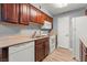 This kitchen features warm wood cabinets, stainless steel appliances, and bright, natural light at 2451 N Rainbow Blvd # 2067, Las Vegas, NV 89108